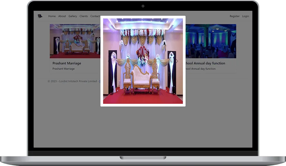 Elegant wedding stage decoration featuring sofa seating, floral backdrops, and event lighting